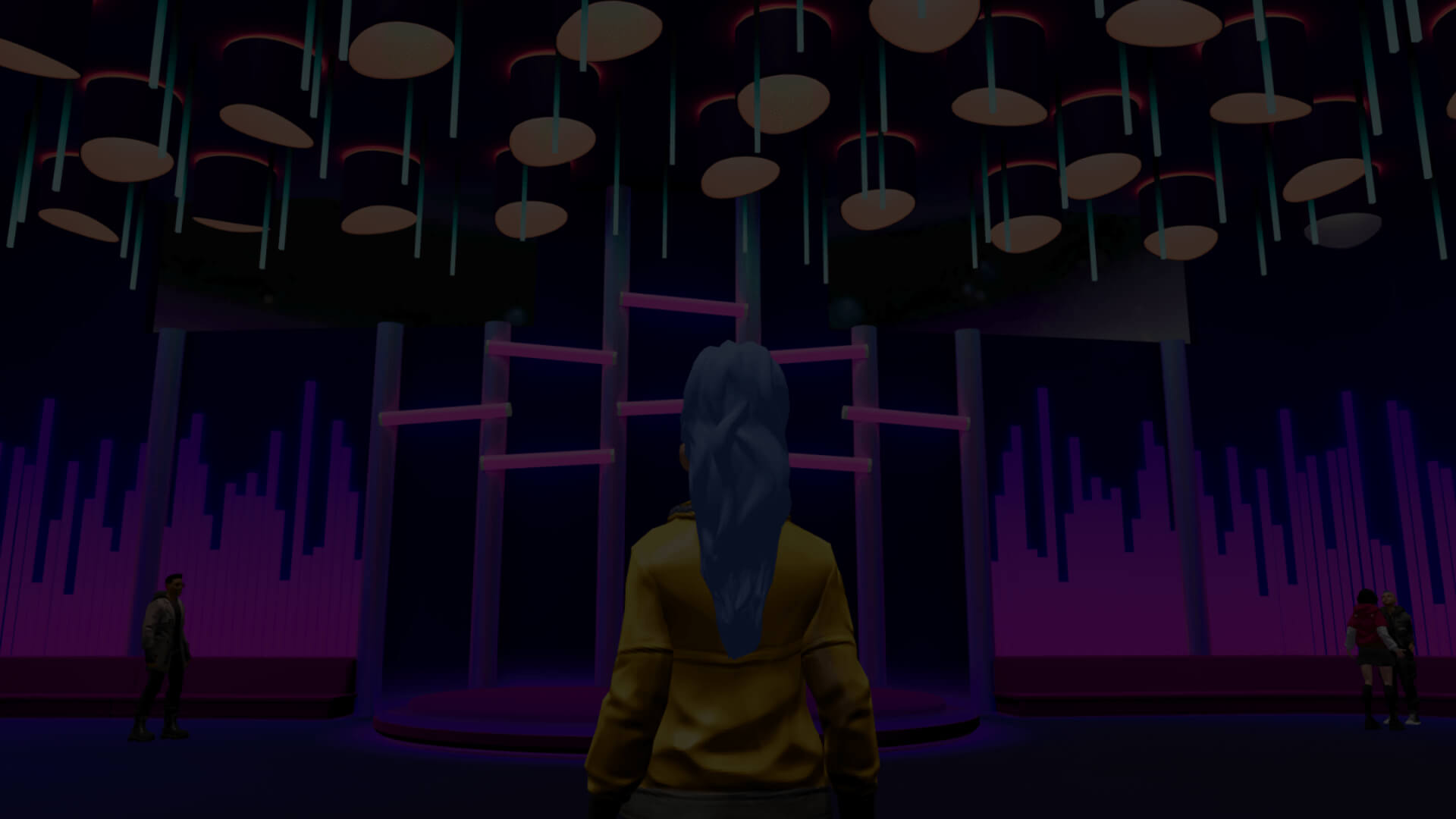 An avatar facing the stage of a lit room inside the venue